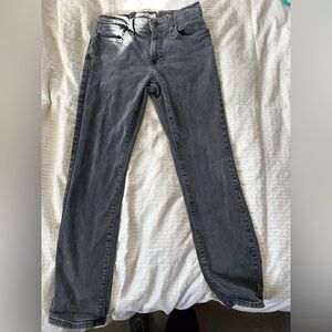 Faded black jeans worn